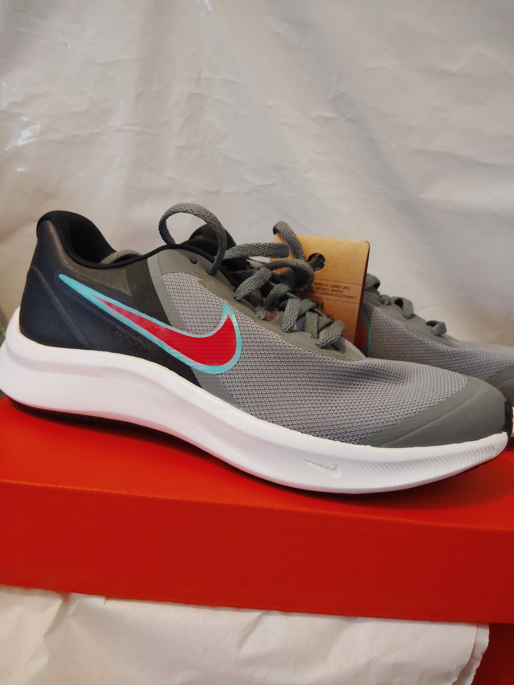 Nike Men's Gray Running Shoes with Red and Teal Swoosh